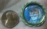 Personal token of affection, a portrait miniature painting in an enameled pin brooch frame.